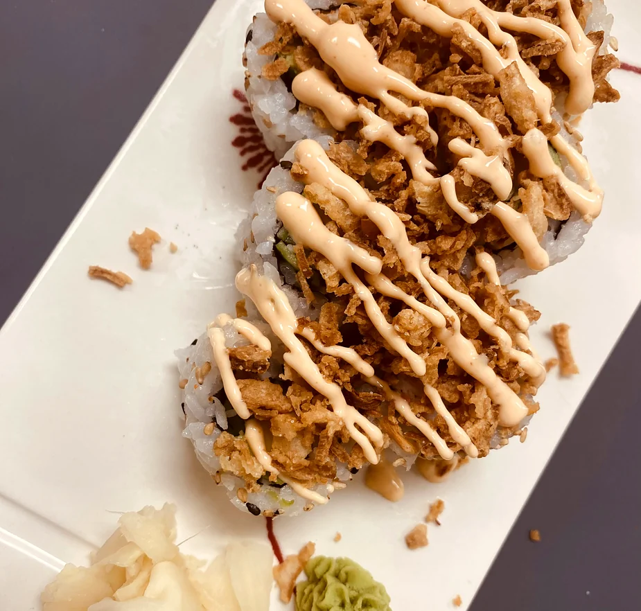 Crunchy California roll topped with crispy fried onion and creamy sauce at Hana Sushi, Winnipeg